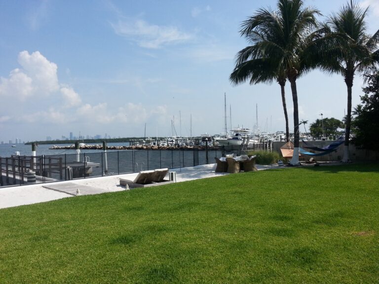 Removable pool safety fence installed along a waterfront seawall in Miami Beach