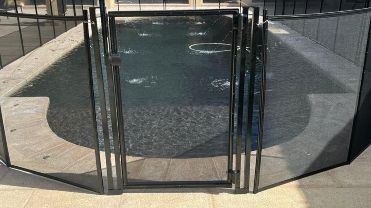 Black removable pool fence and safety gate installed in Coral Gables, Florida